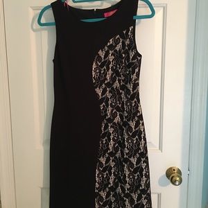 Sleeveless black dress with lace overlay